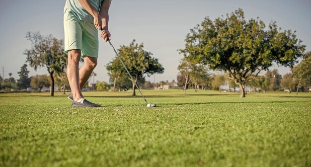 Cropped man playing golf game on green grass golf