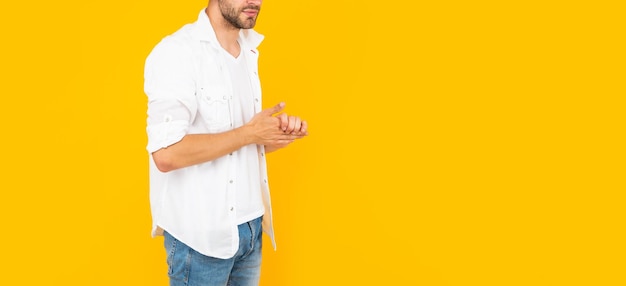 Cropped man in white tshirt on yellow background with copy space casual