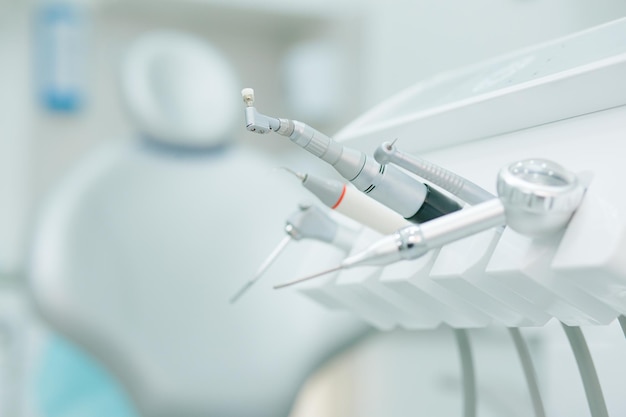 Cropped photo of a modern set of dental tools in the clinic. Website banner