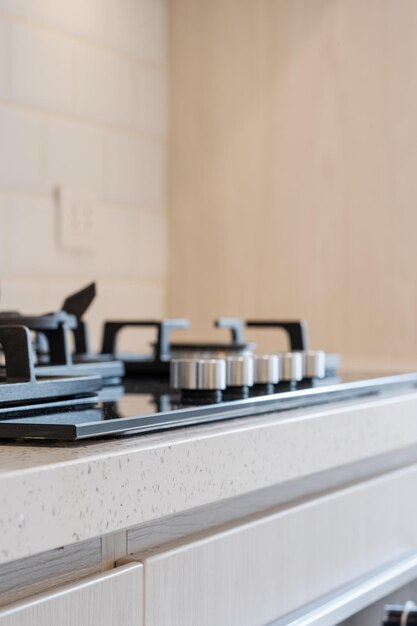 Cropped photo of a part of a stove of a new kitchen