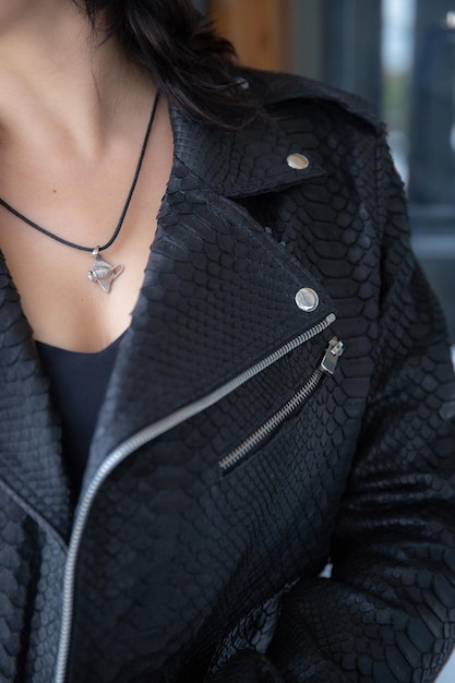 Cropped photo of woman wearing leather black jacket