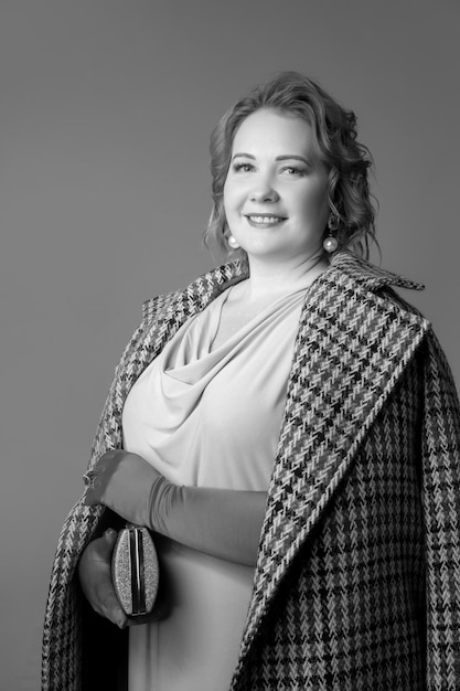 Cropped portrait of stylish beautiful woman with makeup posing. Black and white photography