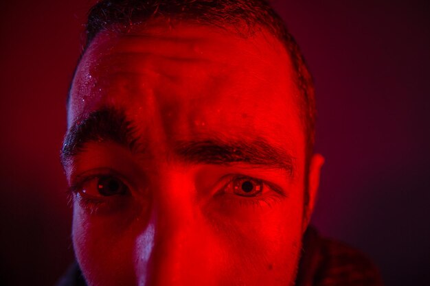 Photo cropped portrait of of tensed man against colored background