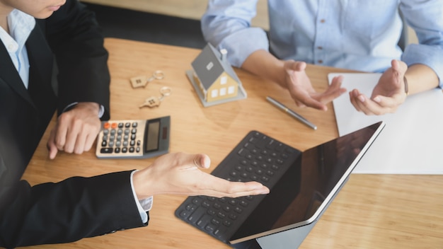 Cropped shot of Business people negotiating about interest to invest in real estate