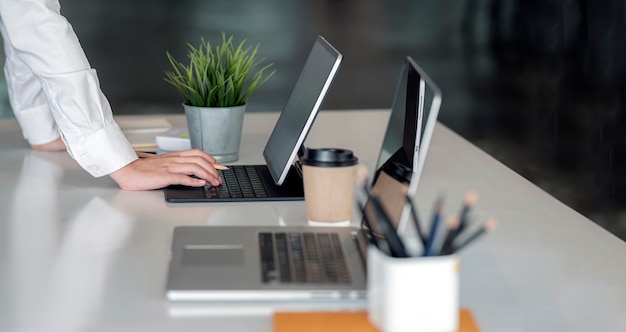 Cropped shot of businesswoman hands working on tablet computer.