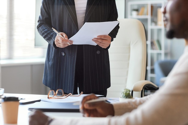 Cropped shot of female boss in business meeting