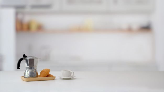 Cropped shot of fruit basket and copy space on marble desk with blurred kitchen room