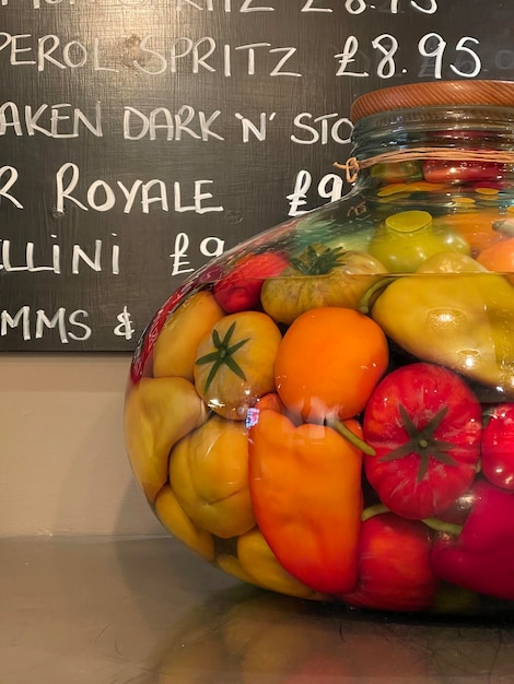 Cropped shot of a huge glass jar full of preserved vegetables