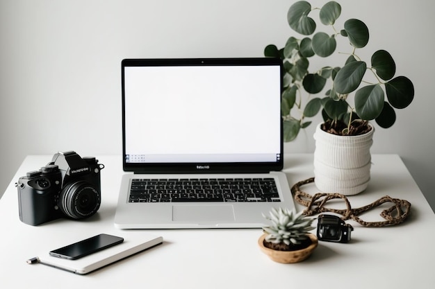 Photo cropped shot of modern workspace with blank screen laptop camera and decorations on wooden desk with white wall background