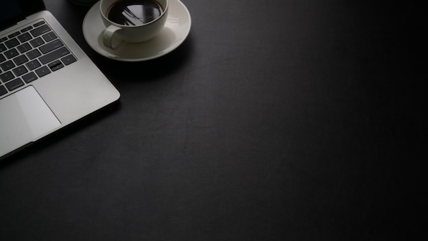 Cropped shot of simple workspace with laptop