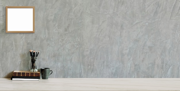 Cropped shot of trendy workplace with copy space and office supplies on marble background and loft grey wall