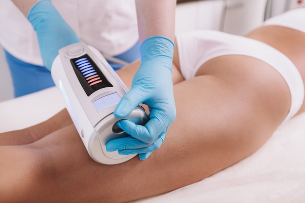 Cropped shot of a woman getting body sculpting treatment at beauty clinic