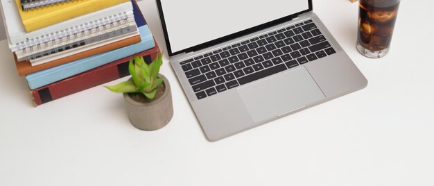 Cropped shot of workspace with  laptop