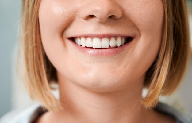 Cropped snapshot of a beautiful female smile demonstrating perfect teeth