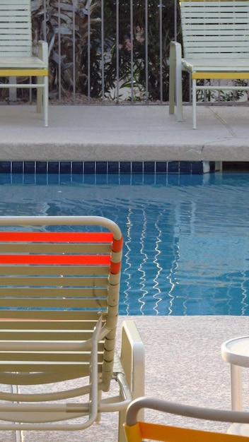 Photo cropped sun loungers by the pool