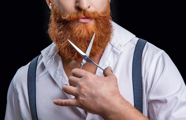 Cropped view of barbershop man with scissors photo of barbershop man on background