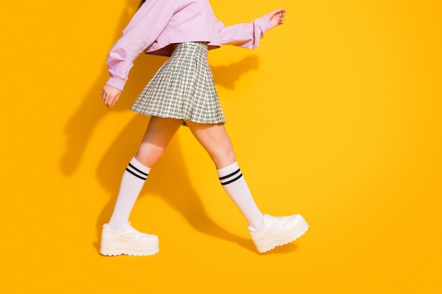 Cropped view of charming millennial girl stroll