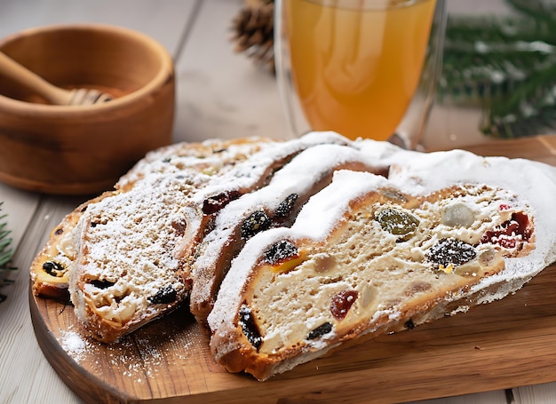 Cropped view of cutted slices of freshly baked traditional homemade German Stollen bread sprinkled