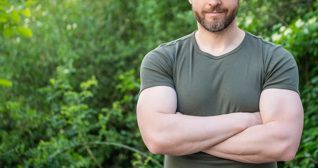 Cropped view of guy crossed arms in shirt caucasian guy with beard mature guy outdoor