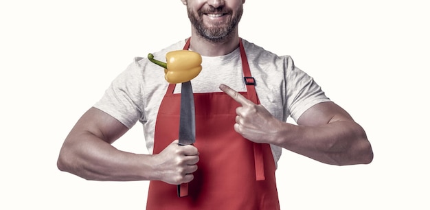 cropped view of man point finger on sweet pepper vegetable and knife isolated on white