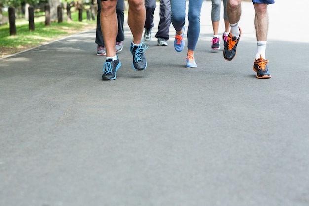 Photo cropped view of marathon athletes feet running