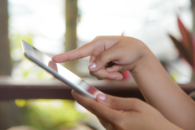 Cropped view of women using a digital tablet