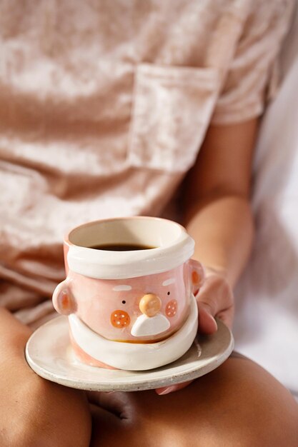 Cropped woman drinking tea Cozy winter time background