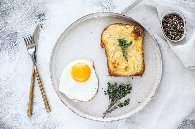 Croque Monsieur a traditional French toasted cheese and ham sandwich with bechamel sauce. Top view