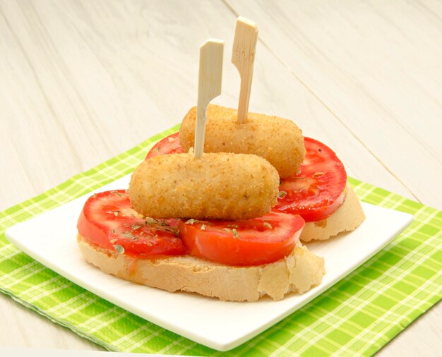 Croquettes on a piece of bread