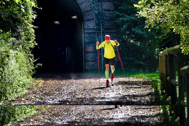 Cross-country skier is prepared with roller skaters in the fall