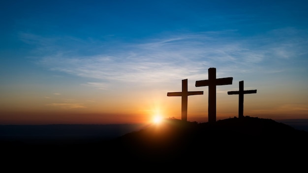 Cross crucifixion of jesus Wooden cross at sunset sky background Crucifixion and resurrection concept