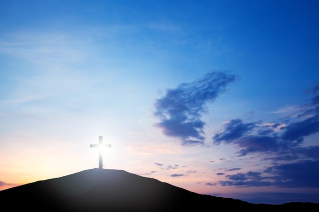 cross on the hill at sunset