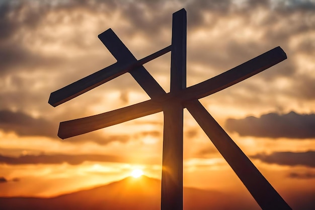 Photo a cross is silhouetted against a sunset sky.