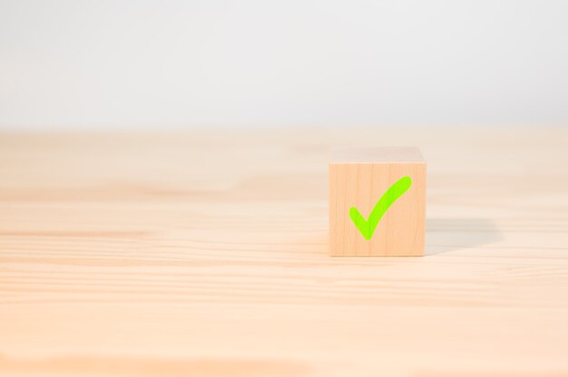 Cross mark x on wooden cube