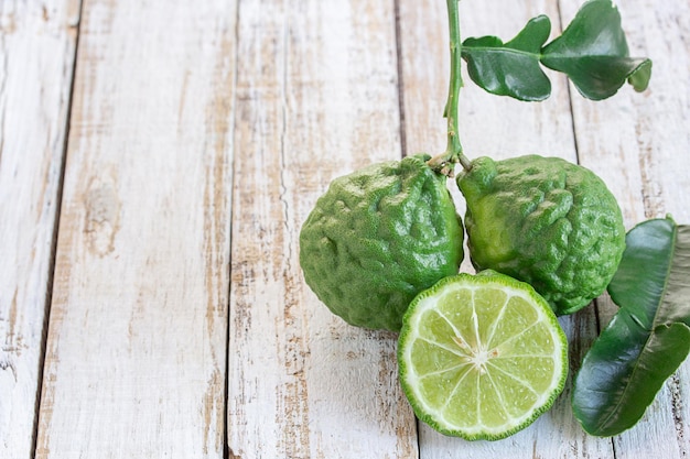 Cross section bergamot or bergamot sliceclose up bergamot on wooden table background kaffir lime