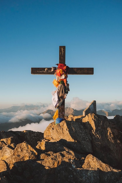 A cross at the summit of mont valier pyrenees at sunrise