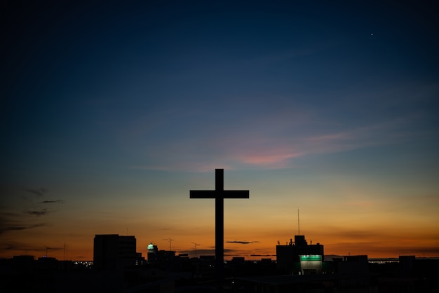 The Cross at the sunset background