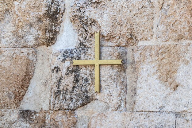 Cross on wall at temple