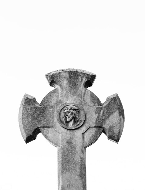 A cross with a face on it