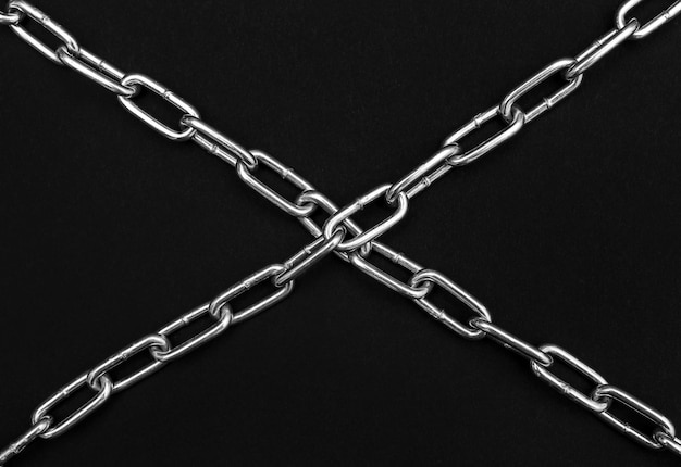 Crossed chains on black background Security concept