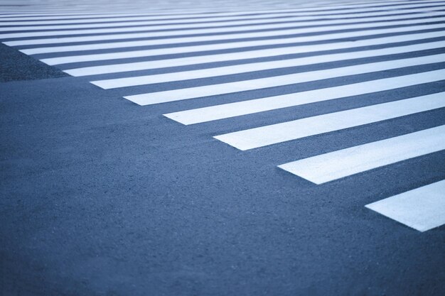 Crosswalk road area for pedestrian crossing by bringing black and white stripes like the color of a zebra person