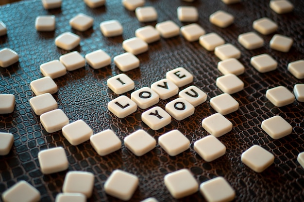 Crossword game pieces forming the phrase "I love you"