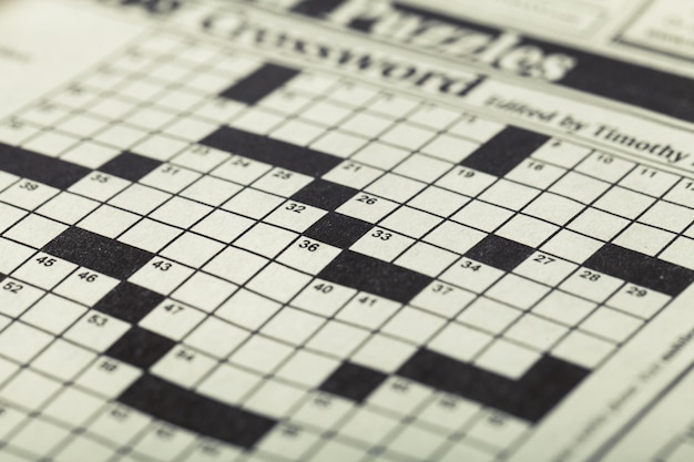 Photo crossword puzzle and pencil on background