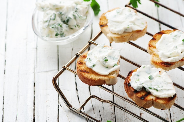 Photo crostini with cottage cheese and parsley