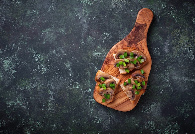 Crostini with mushrooms and green onion. 