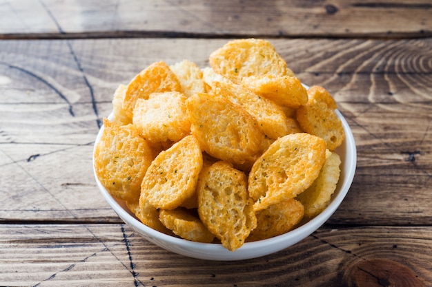 Croutons of white bread baguette with spices in dishes.