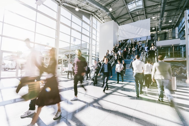 crowd of anonymous blurred business people at a tradeshow