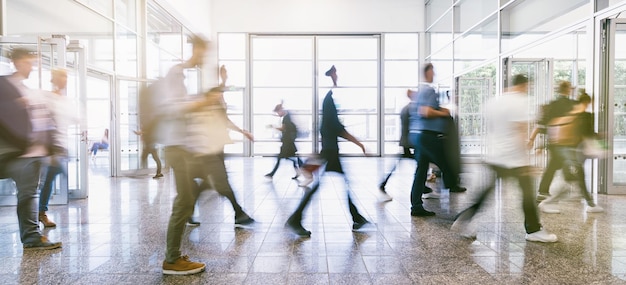 Crowd of blurred business people at a trade fair floor