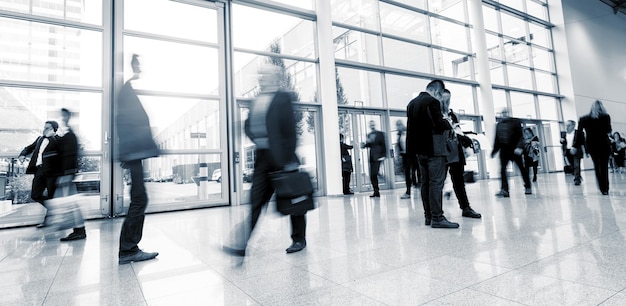 crowd of business people walking at a modern floor, including copy space banner. ideal for websites and magazines layouts