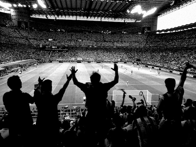 Photo crowd enjoying at soccer stadium